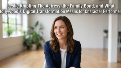 Leslie Knipfing smiling in a modern office, wearing a blue blazer, illustrating an article about character performers.